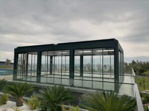 Modern Aluminum Pergola With Sliding Oversized Doors and Motorized Roof Shutters IMG3