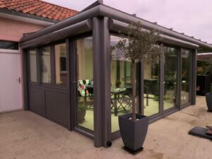 Pergola With Retractable Shatters and Sliding Widnows and Glass Doors